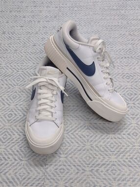 Nike White Sneakers with Navy Blue Swoosh